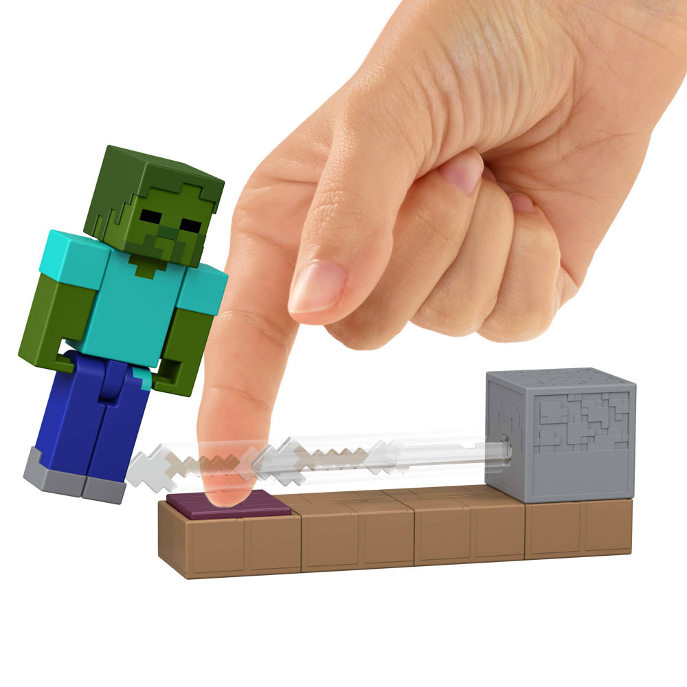 Hand playing with the Minecraft Redstone Zombie Arrow Trap Figure toy