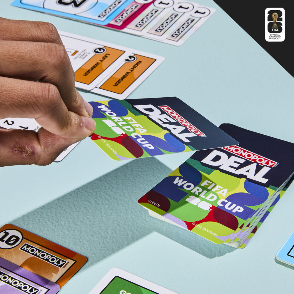 Kids playing the Monopoly Deal FIFA Edition Card Game Set