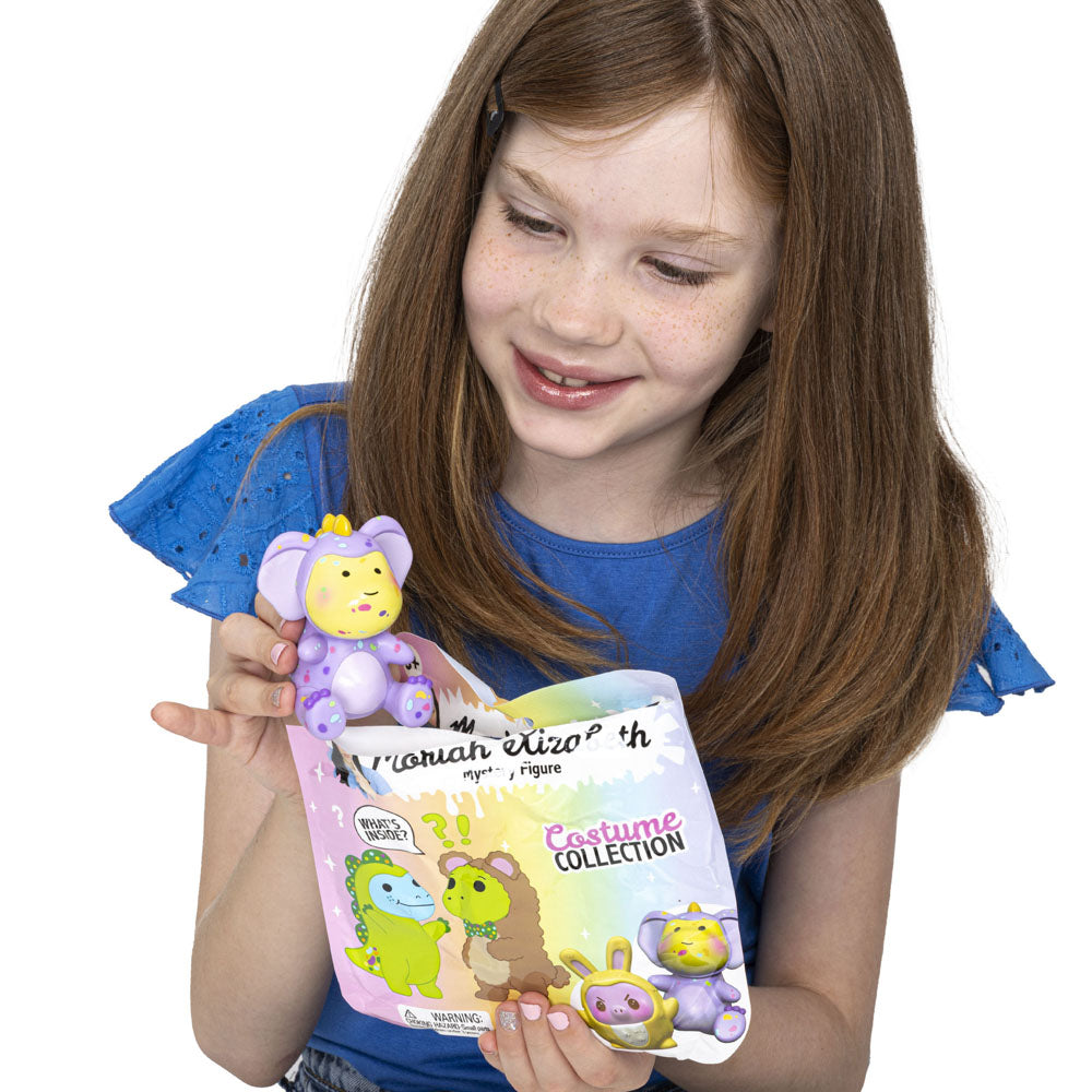Child holding a Moriah Elizabeth Costume Collection Series 3 Blind Bag toy.