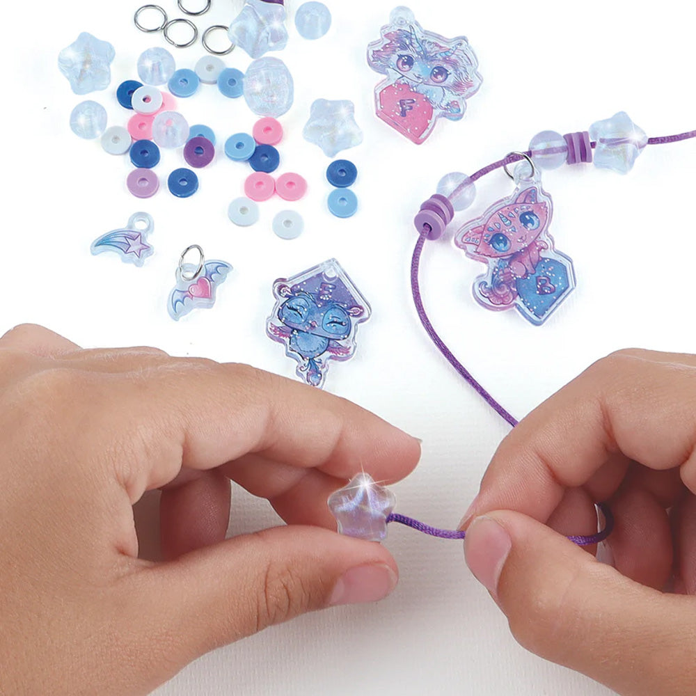Child making a necklace with the Nebulous Stars Friendship making Necklaces jewellery Kit