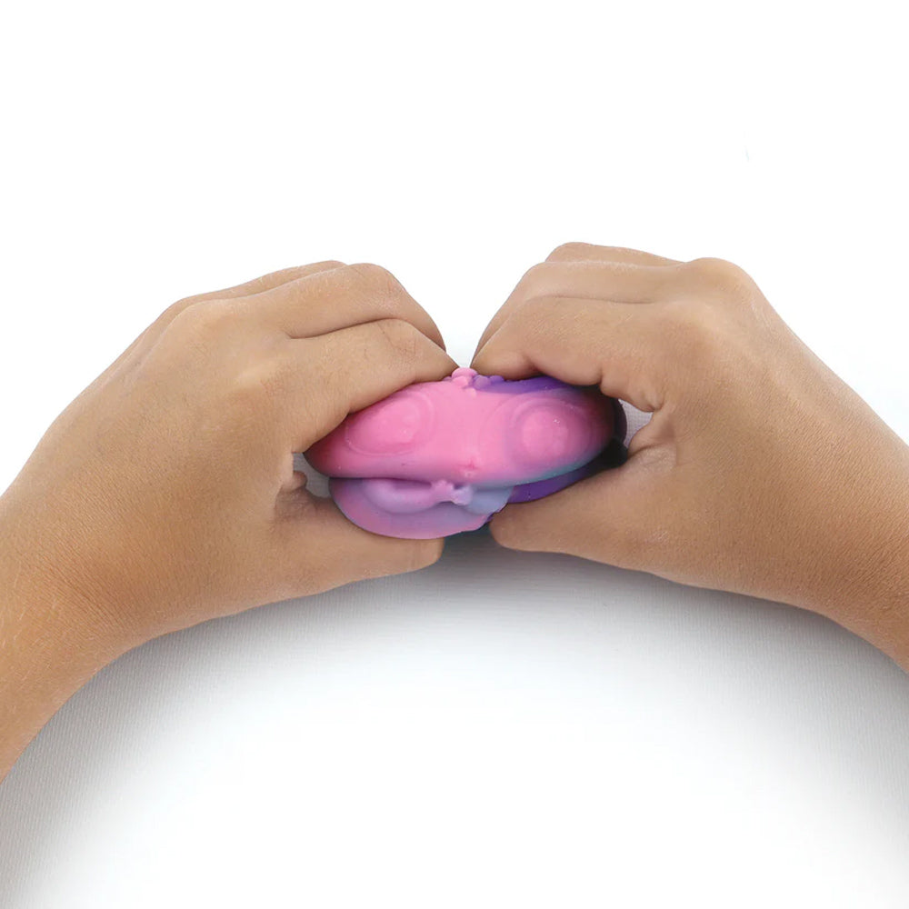 Hands squishing a Nebulous Stars Squishy Mochi Blind Box figure toy