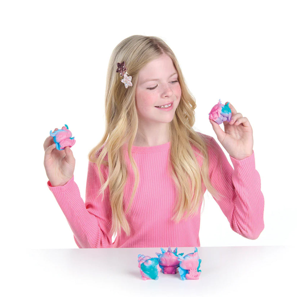 Child playing with the Nebulous Stars Squishy Mochi Blind Box figure toys