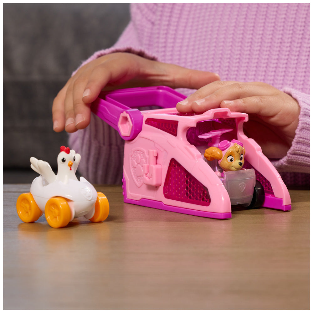 Child playing with the PAW Patrol Pup Squad Launchers Pink Toy Car - Skye & Chicken