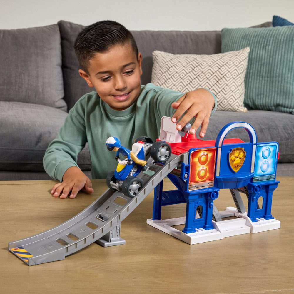 Child playing with the PAW Patrol Search & Rescue Lift "N" Repair Playset with ATV quad bike.