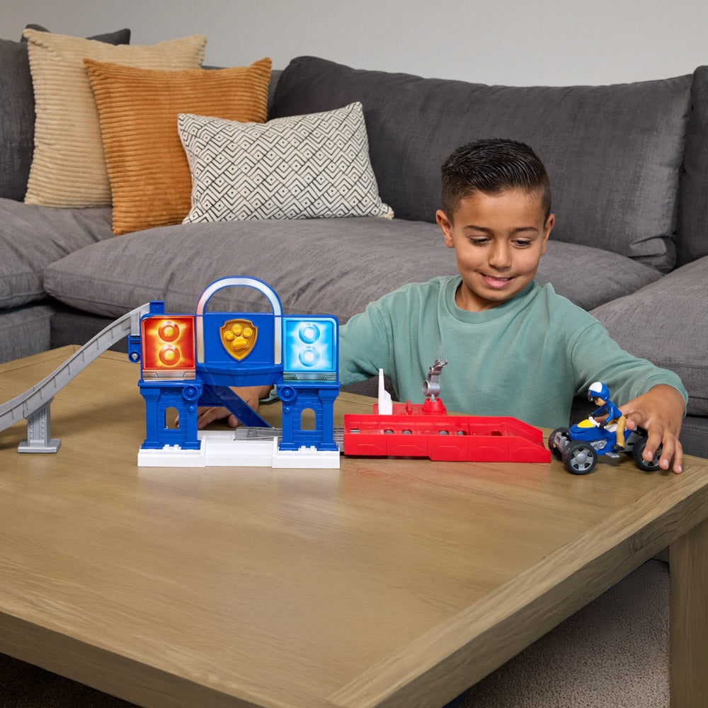 Child playing with the PAW Patrol Search & Rescue Lift "N" Repair Playset with ATV quad bike.