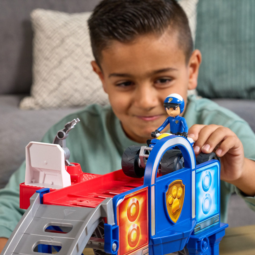 Child playing with the PAW Patrol Search & Rescue Lift "N" Repair Playset with ATV quad bike.