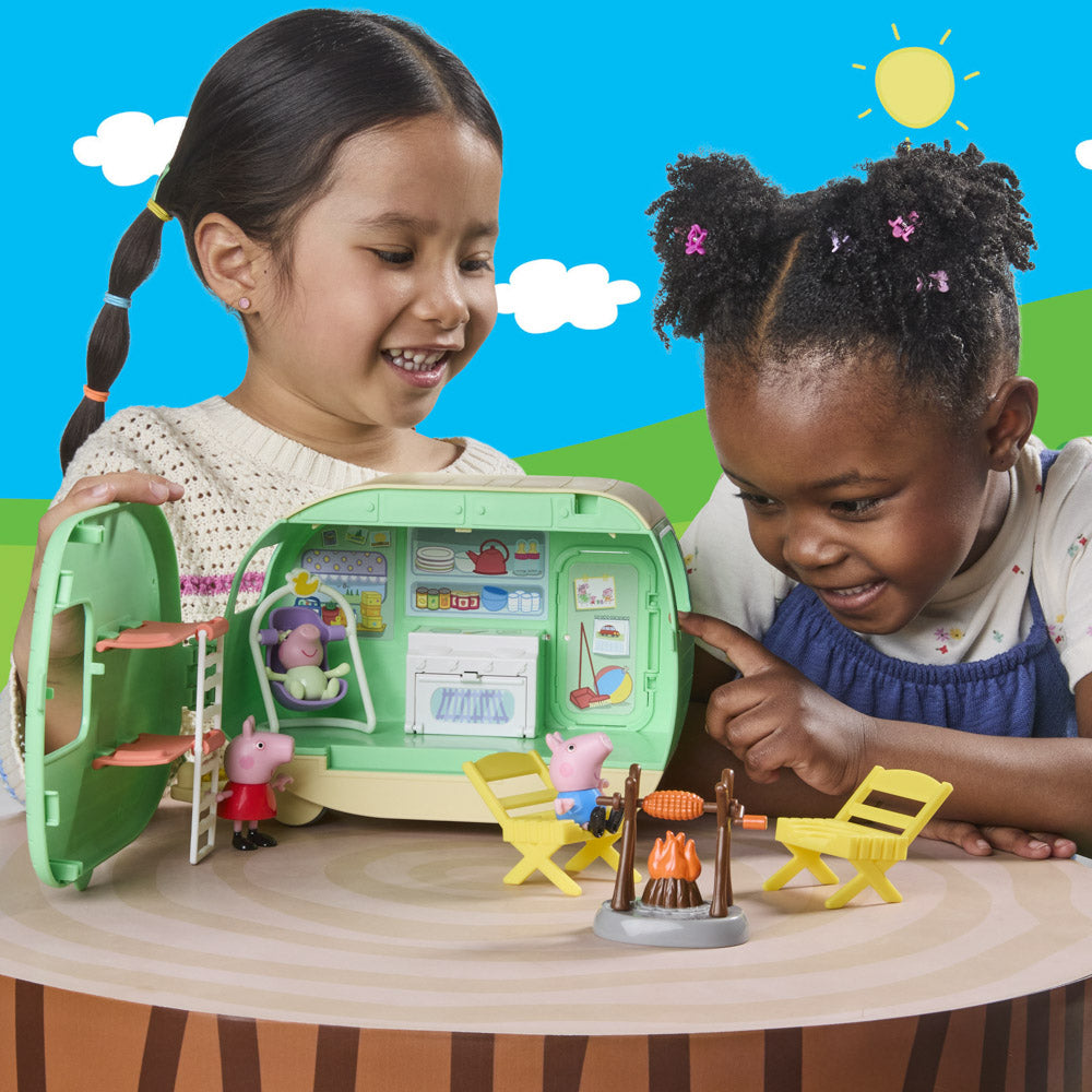 Little girls playing with the Peppa Pig Three Little Piggies Caravan playset