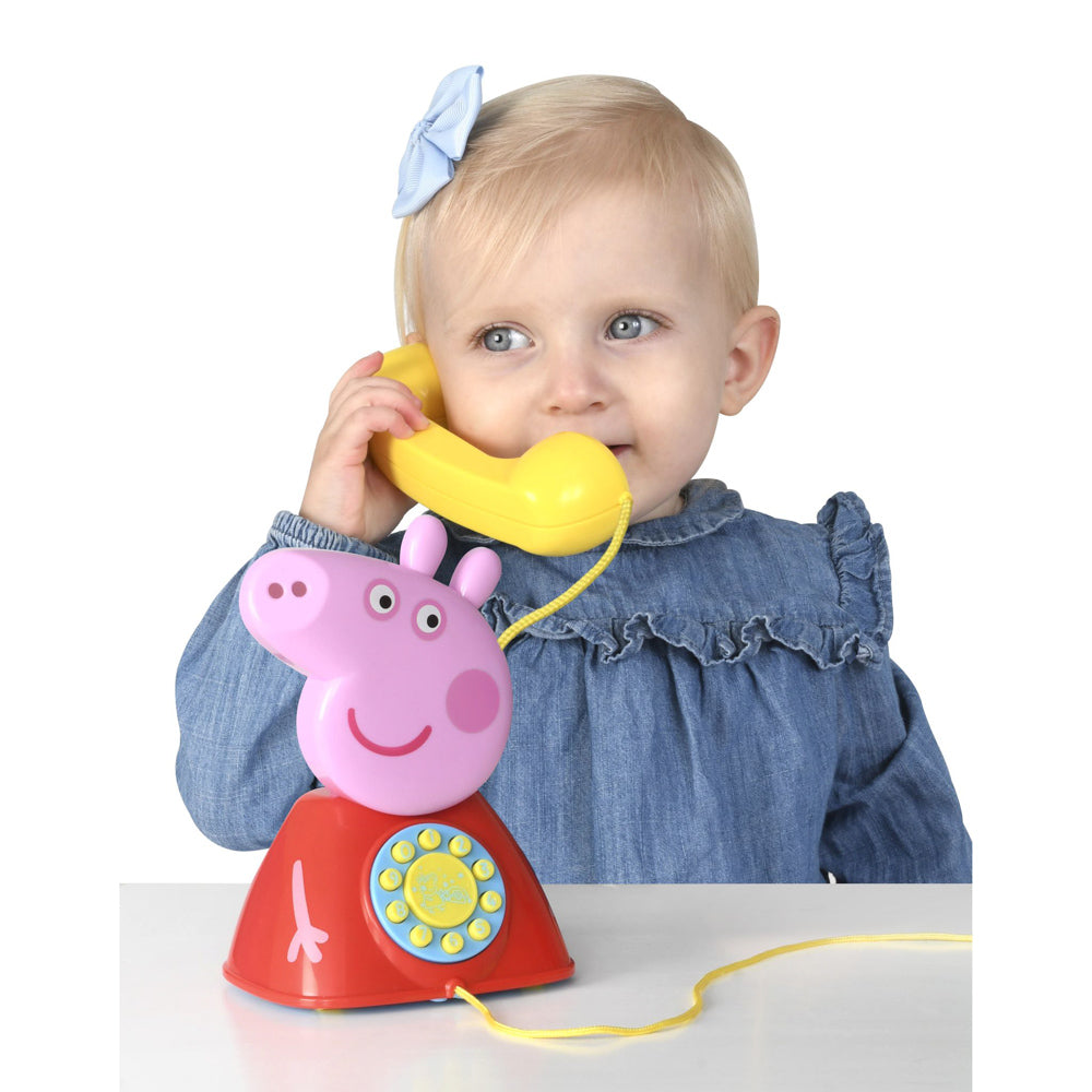Child playing with the Peppa Pig Peppa's Telephone phone with cord