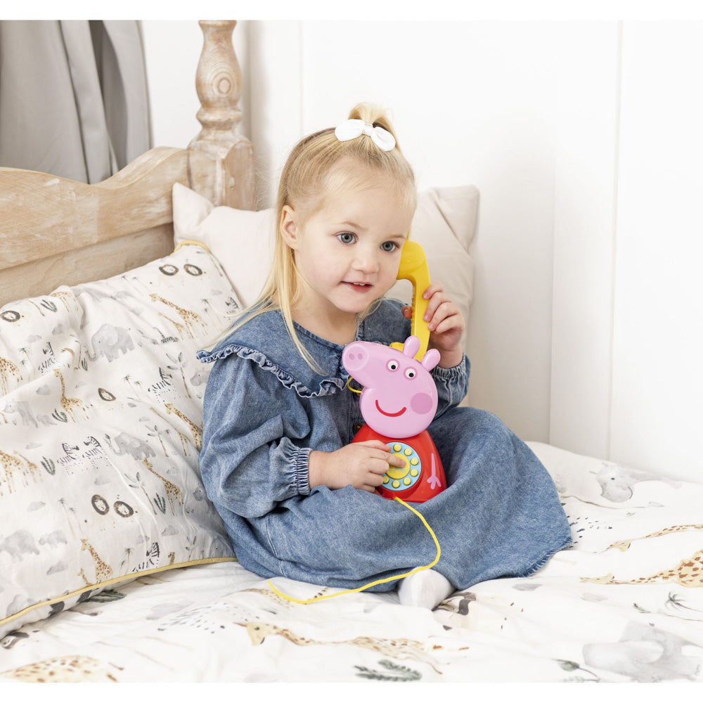 Child talking on the Peppa Pig Peppa's Telephone phone with cord