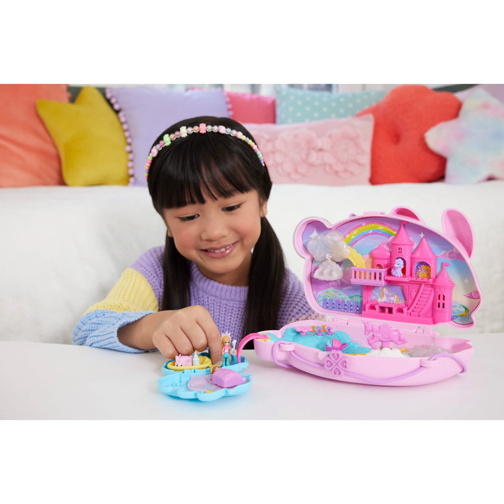 Child playing with the Polly Pocket 2-in-1 Bunny Fun Compact toy playset