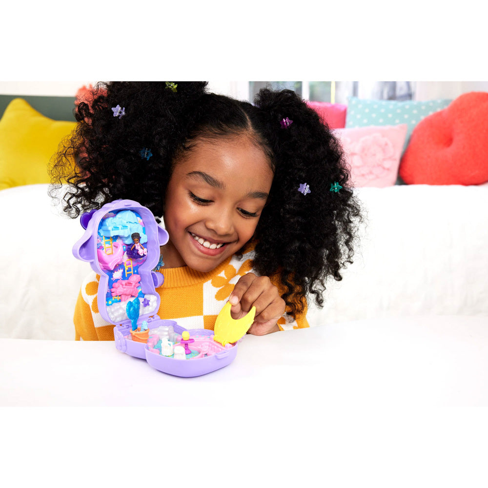 Child playing with the Polly Pocket World Compact - Cozy Dreamland toy playset