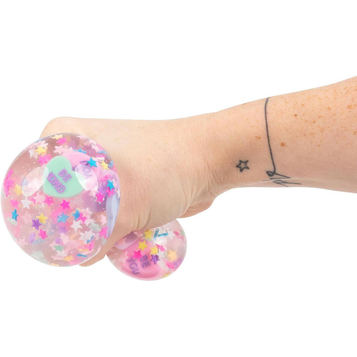 Scrunchems Mindfulness Squishy Ball filled with confetti and heart-shaped candy/conversation hearts.
