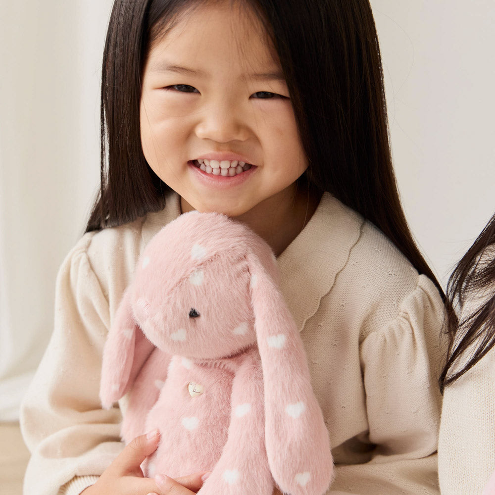Girl holding the Snuggle Bunnies Penelope the Bunny 30cm Plush soft toy - Little Love