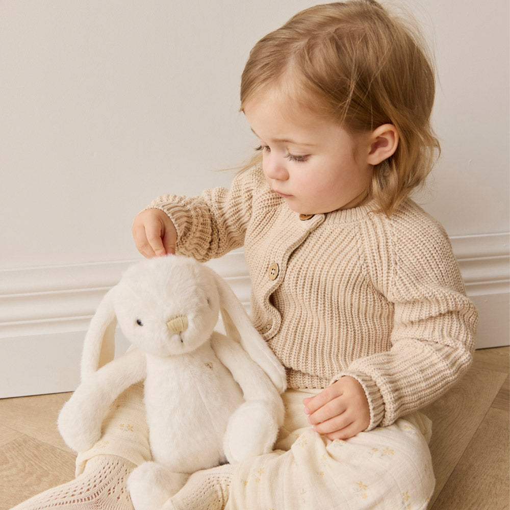 Baby playing with the Snuggle Bunnies Penelope the Bunny 30cm Plush soft toy - Marshmallow