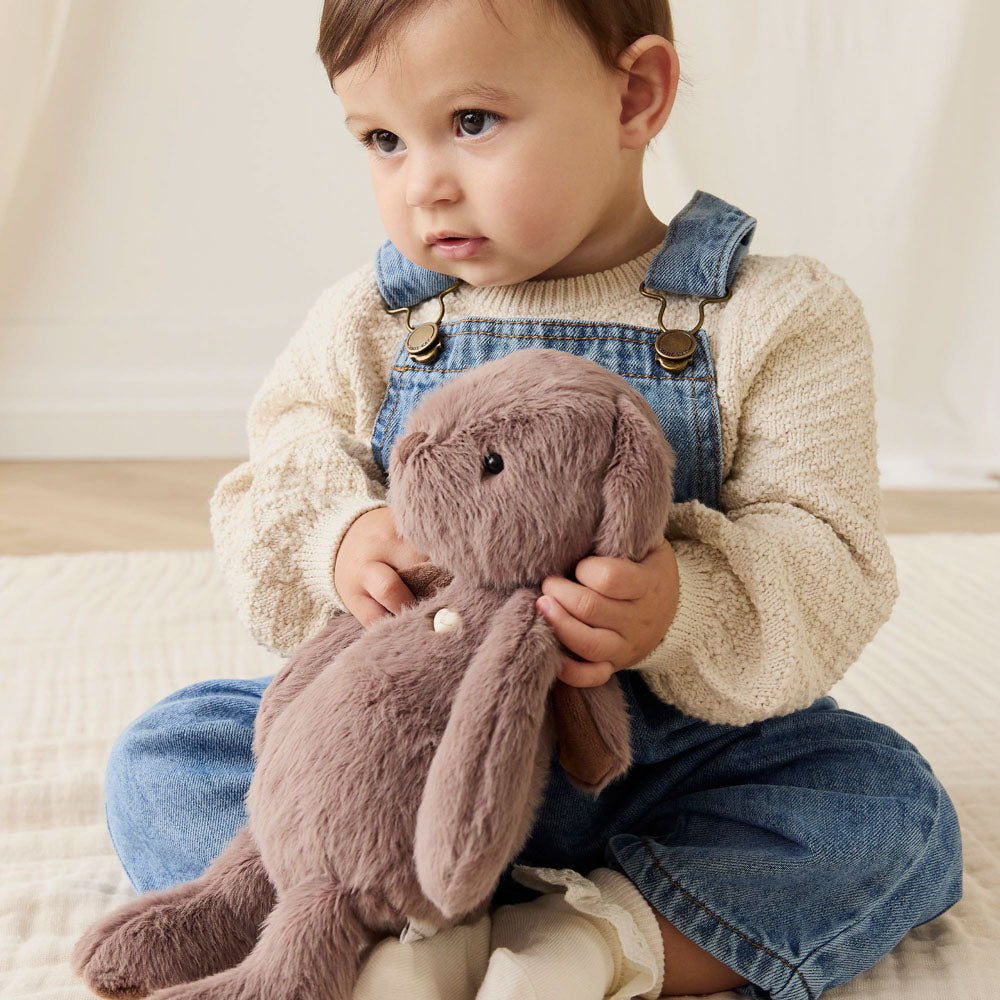 Baby holding the Snuggle Bunnies Penelope the Bunny 30cm Plush Soft Toy - Spice