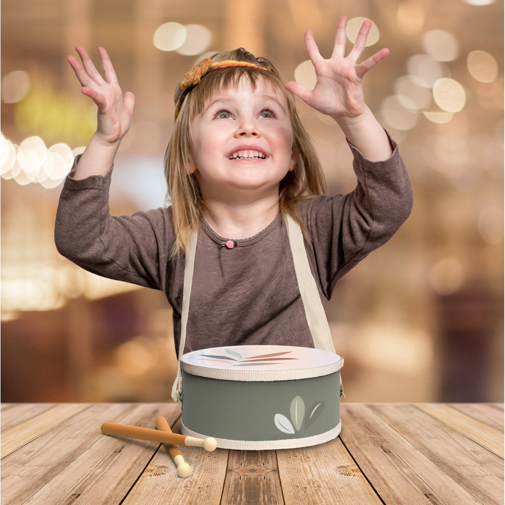 Child playing with the Speedy Monkey Wooden toy Drum