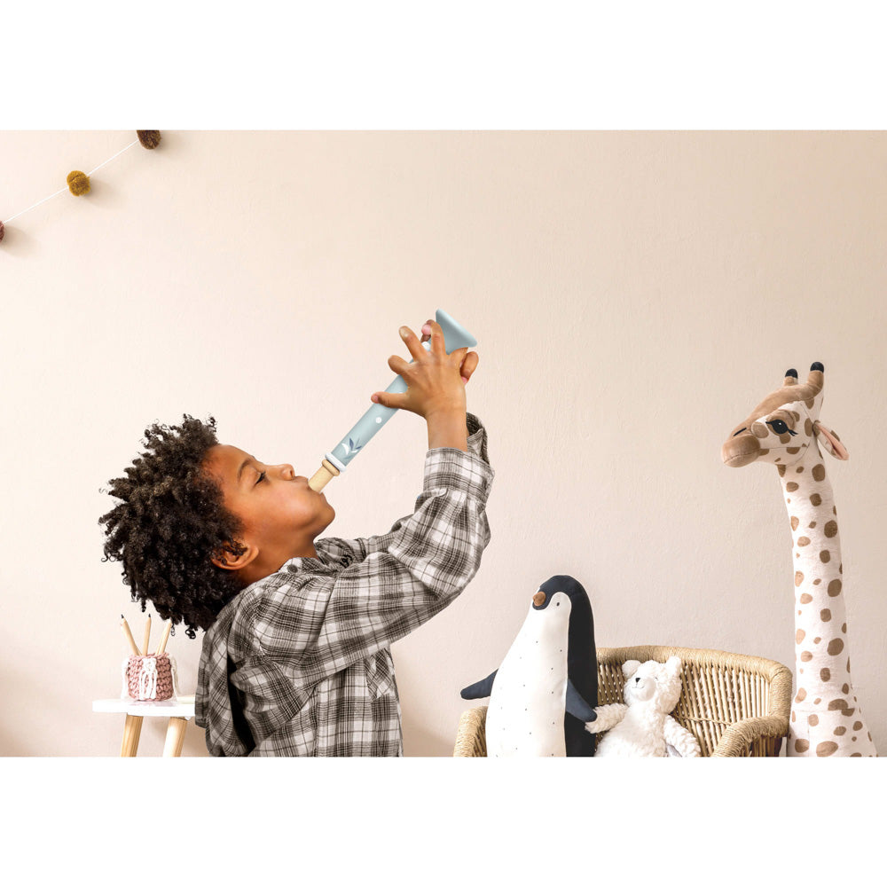 Child playing with the Speedy Monkey Wooden Trumpet toy Assorted Styles