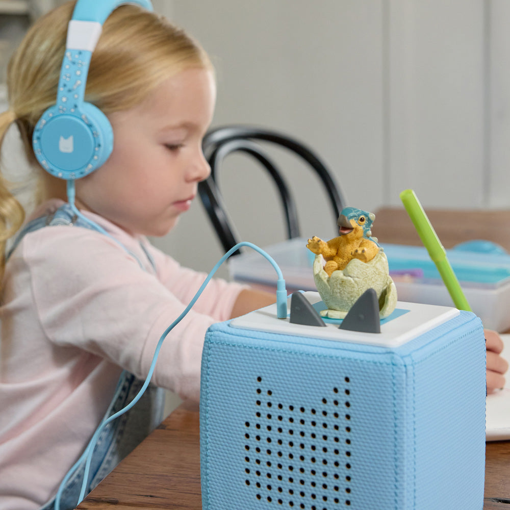 Child listening to the Tonies Audio Character - Jurassic World Dinosaur Camp Cretaceous figure