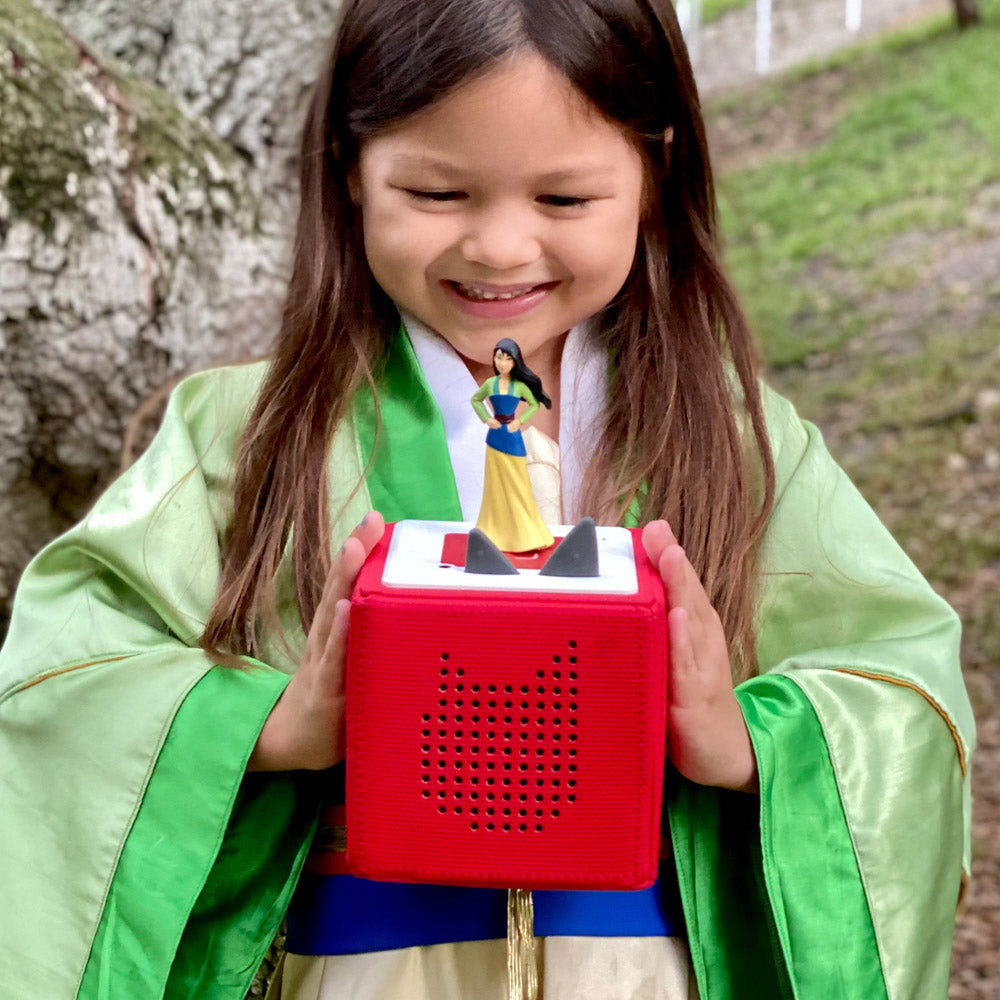 Girl playing with the Tonies Audio Character - Disney Mulan figure