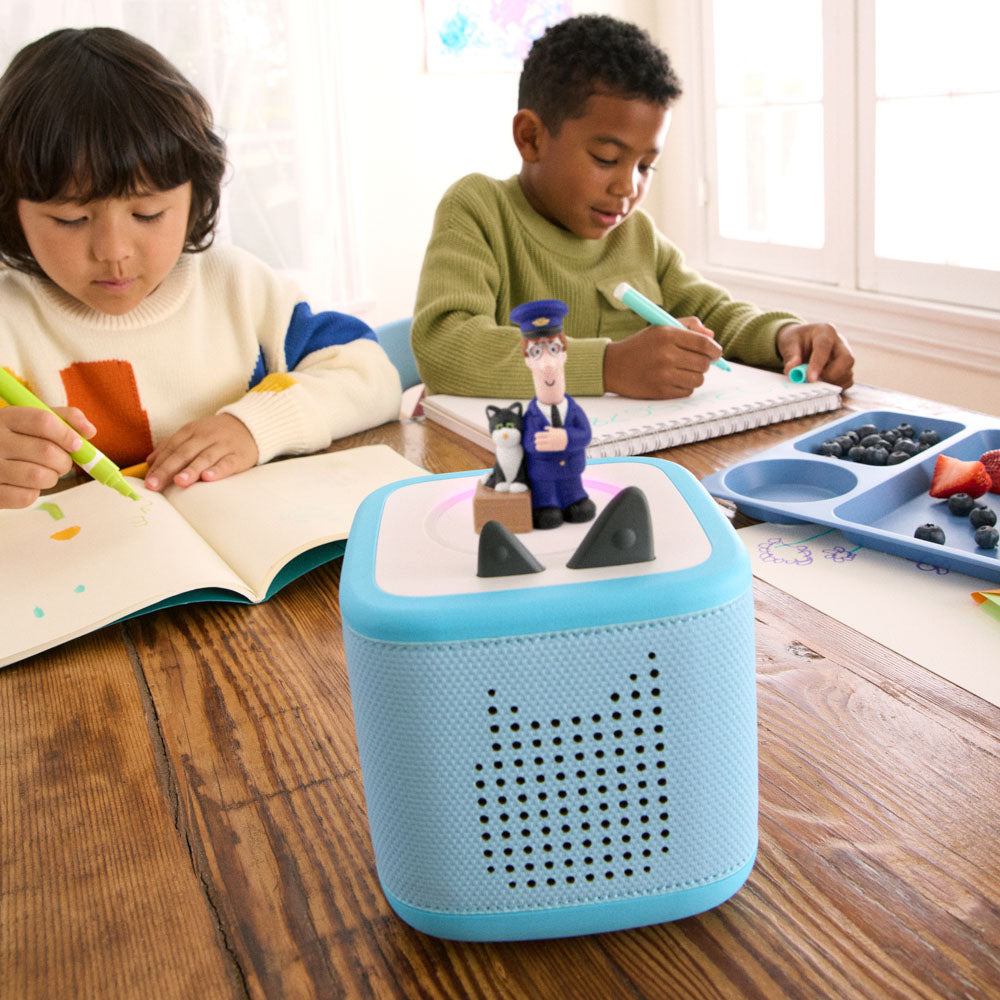 Children listening to the Tonies Audio Character - Postman Pat & Cat figure