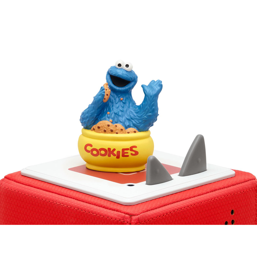 Tonies Audio Character Sesame Street Cookie Monster figure, on top of toniebox