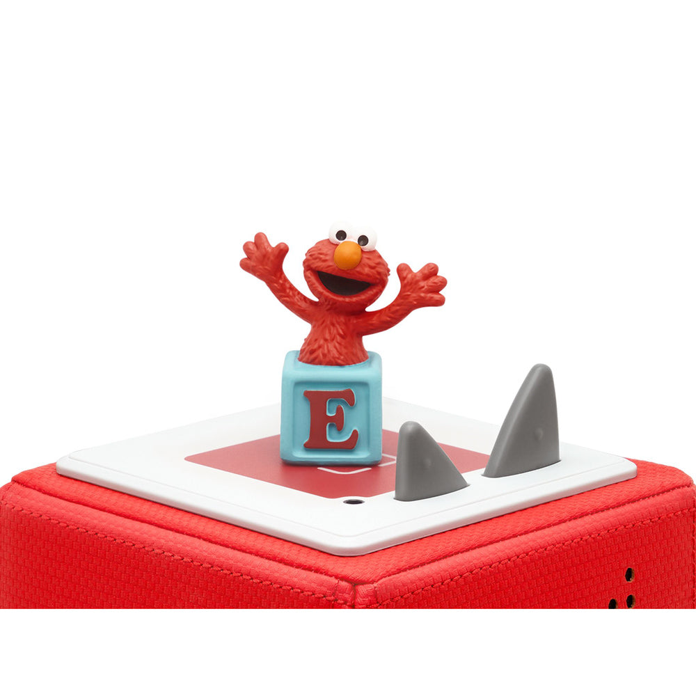 Tonies Audio Character Sesame Street Elmo figure, on top of toniebox