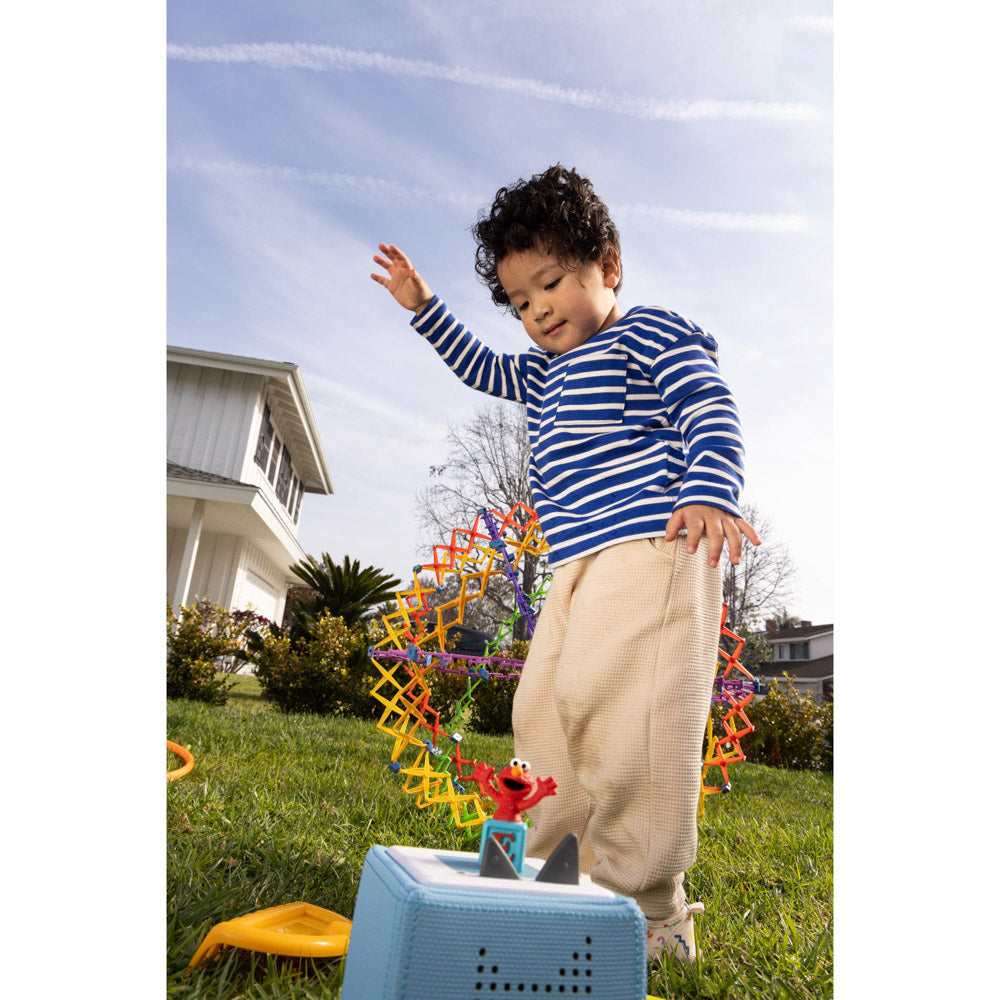 Child playing with the Tonies Audio Character Sesame Street Elmo figure
