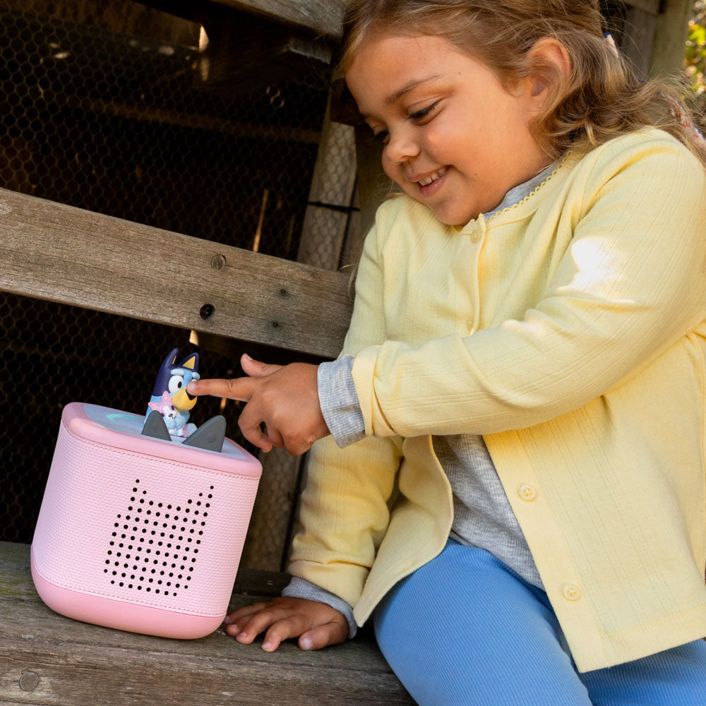 Child playing with the Tonies Audio Characters Bluey 3-Pack multipack with bluey, bingo and muffin.