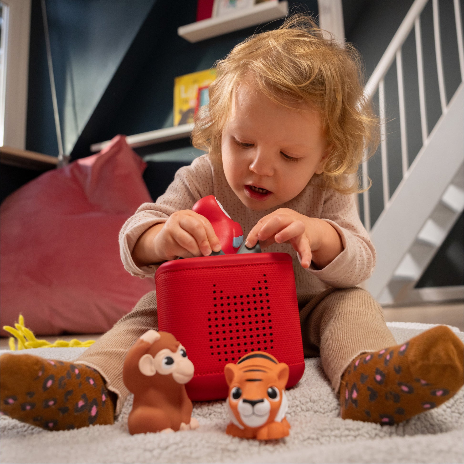 Toddler listening to the Tonies My First Tonies - Jungle 3 Pack Set