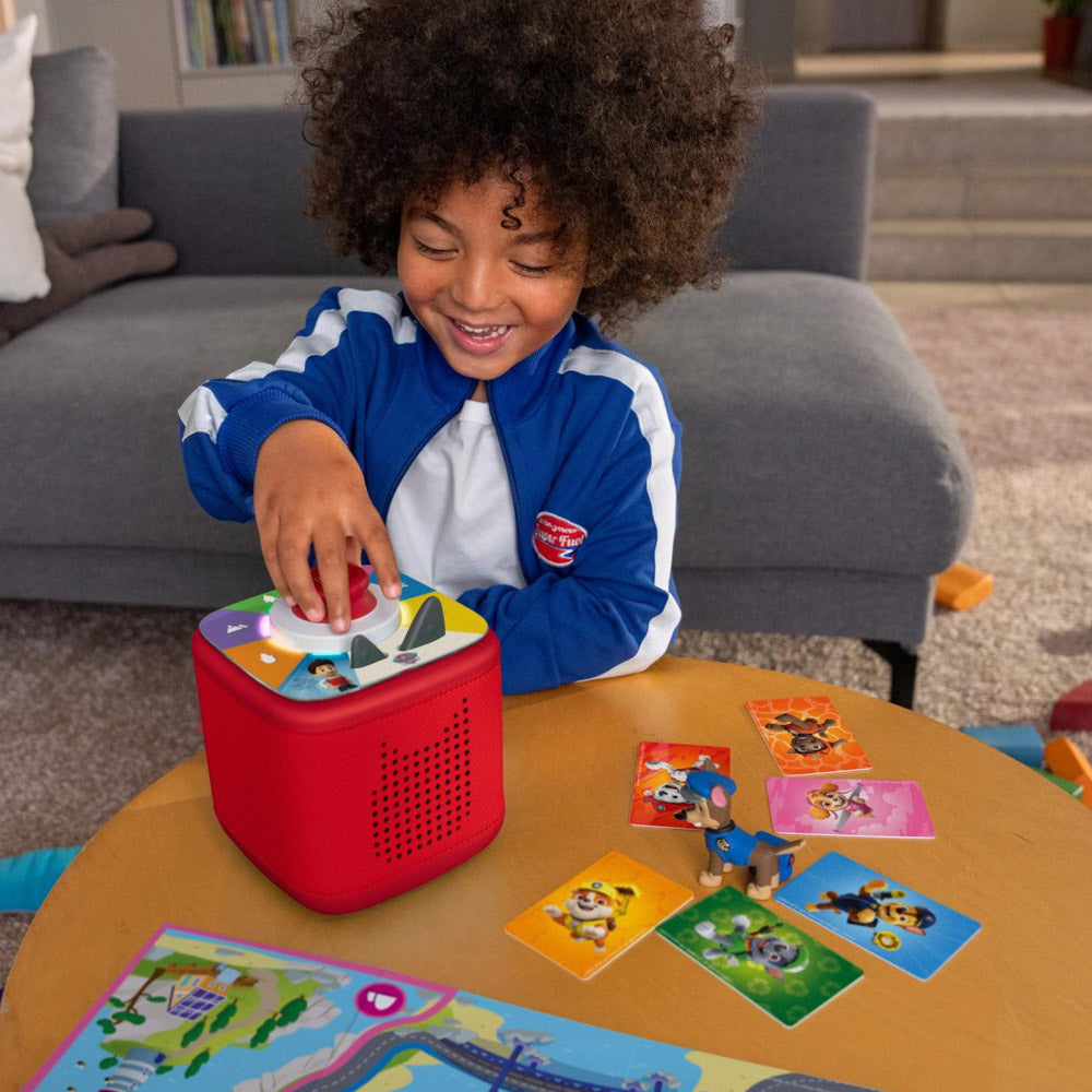 Child playing with the Tonies PAW Patrol Toniebox 2 Full Playset Sunset Red speaker