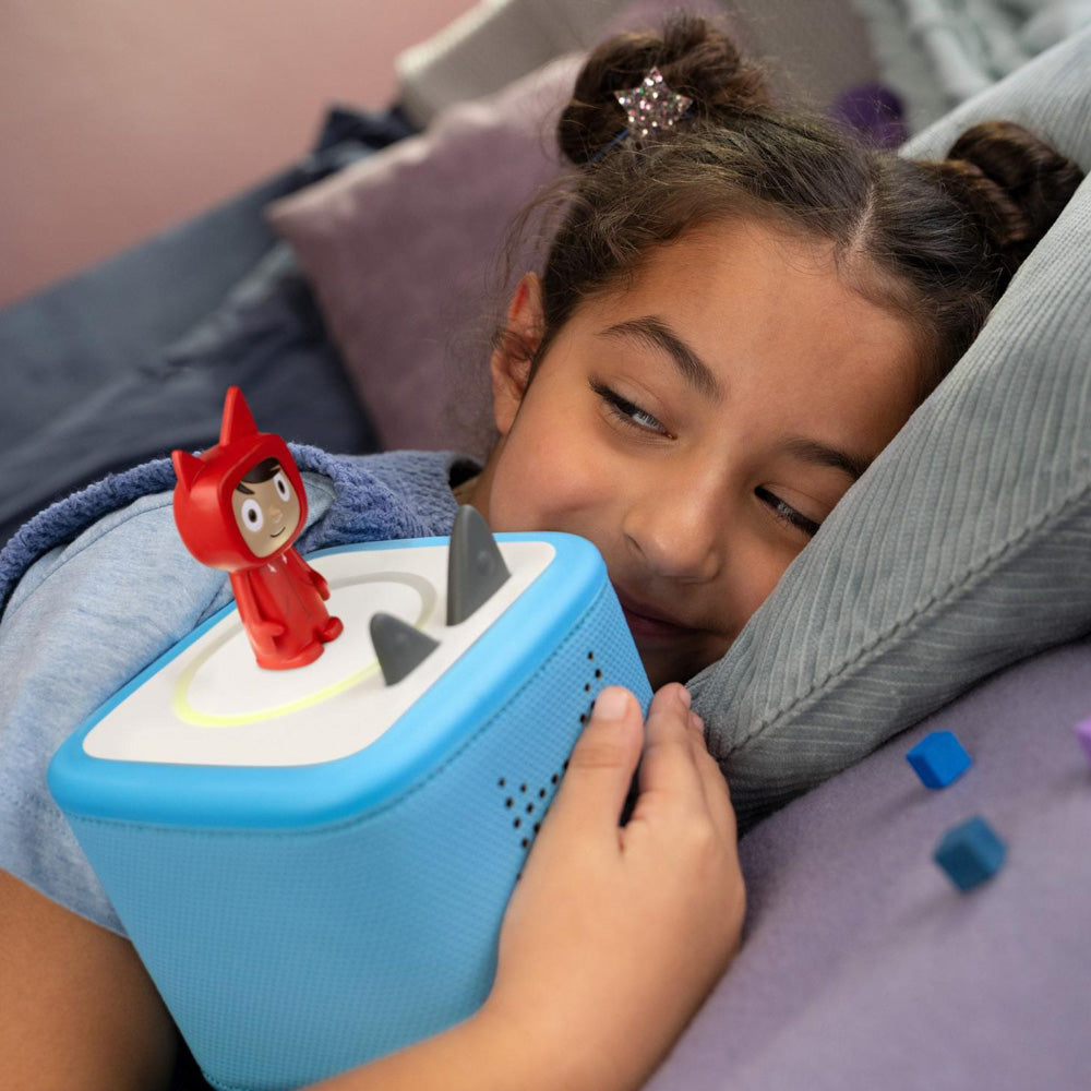 Child holding the Tonies Toniebox 2 Creative Tonie Rubie Starter Set Sky Blue speaker