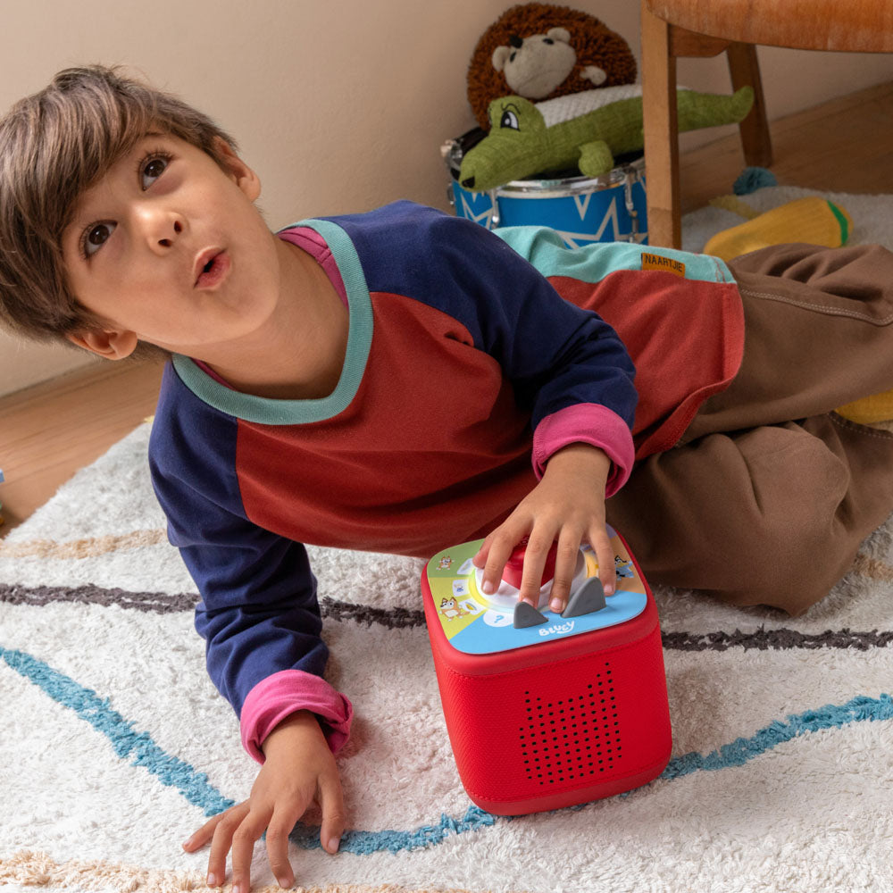 Child playing with the Tonies Tonieplay Game - Bluey: (Your Playful Day with Bluey)