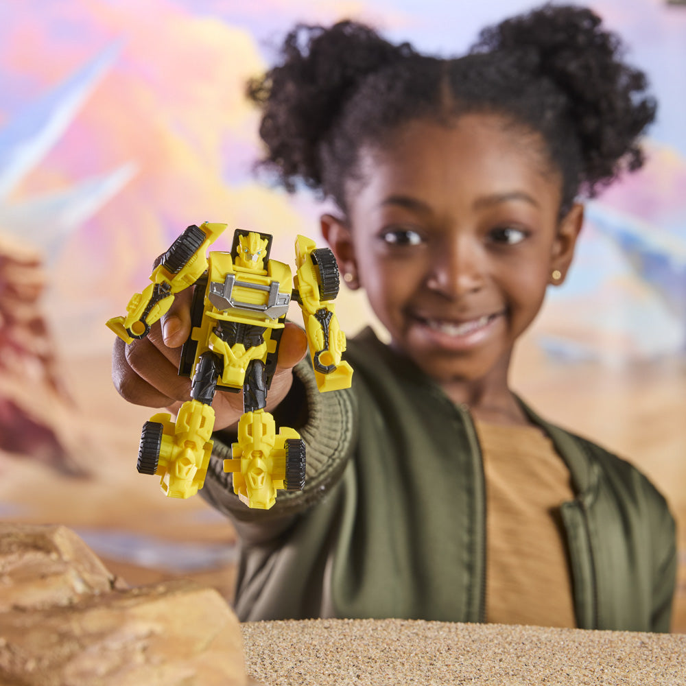 Child playing with the Transformers Cyberworld Armored Cyber Changers - Bumblebee Offroad figure toy