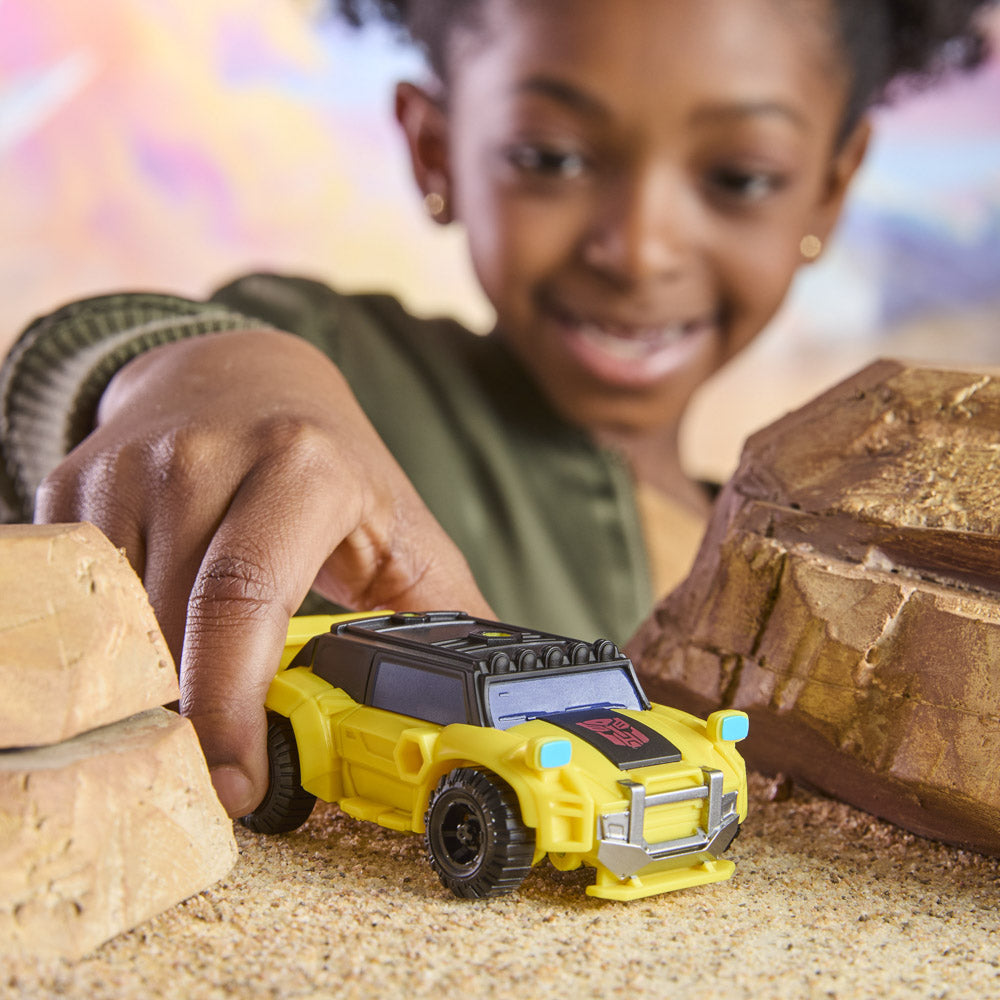 Child playing with the Transformers Cyberworld Armored Cyber Changers - Bumblebee Offroad figure toy