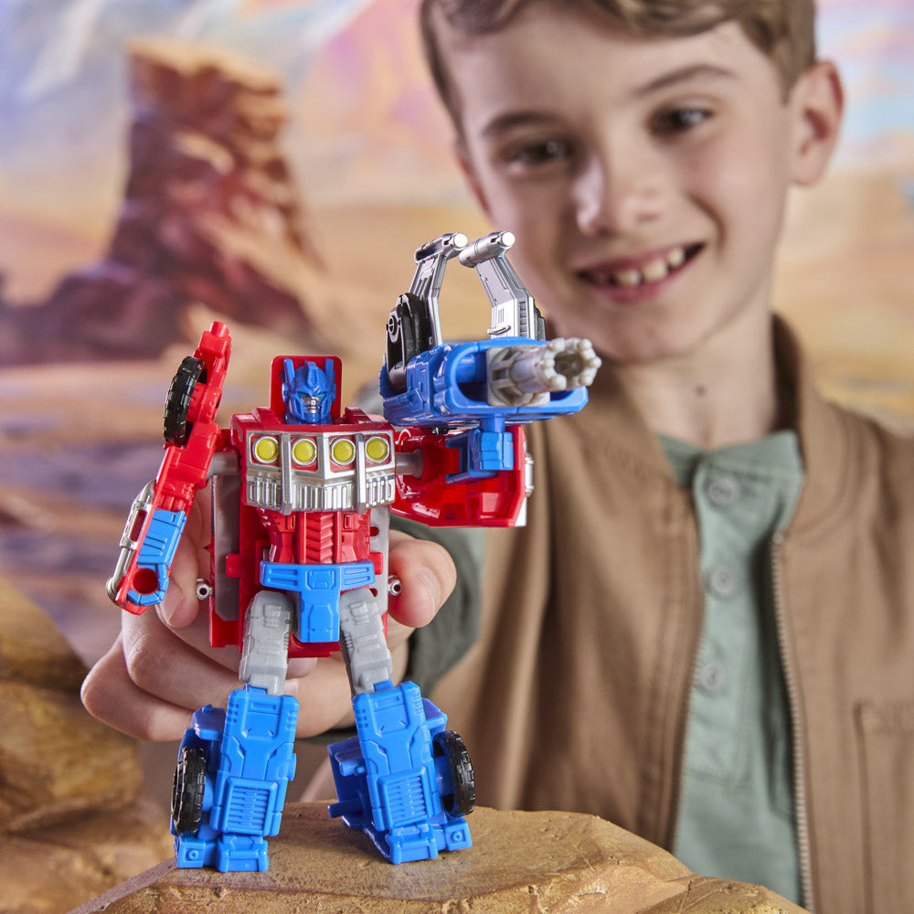 Child playing with the Transformers Cyberworld Armored Cyber Changers Optimus Prime figure