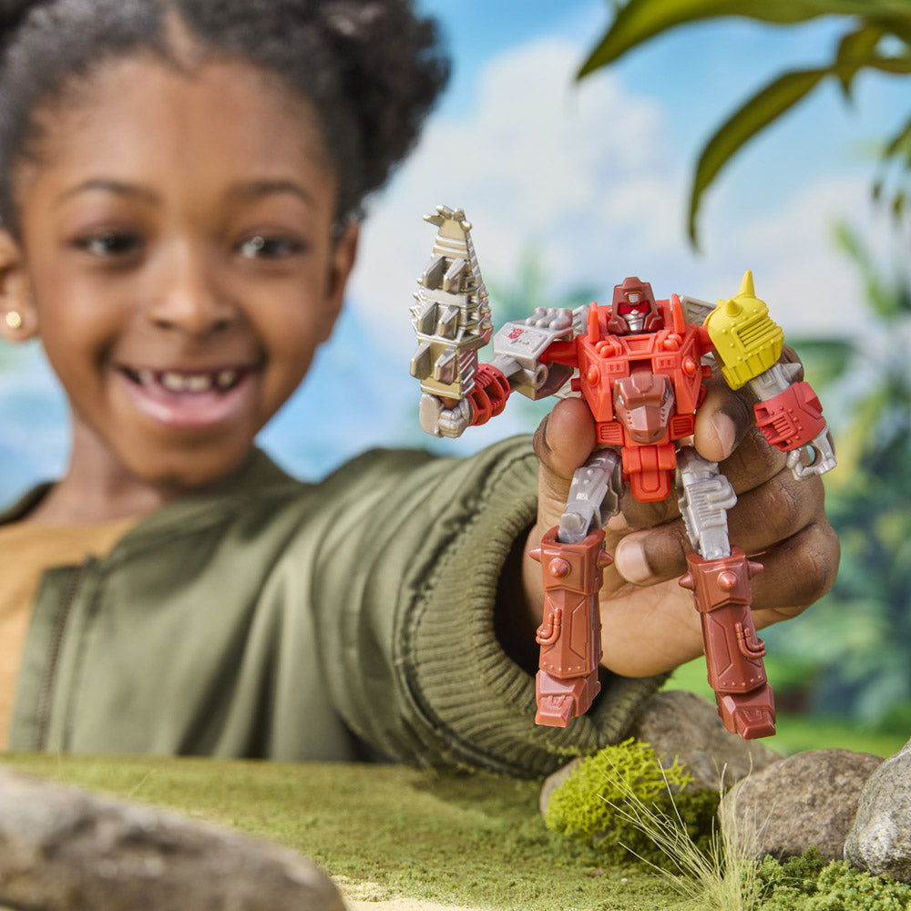 Child playing with the Transformers Cyberworld Cyber Changers Dinobot Snarl figure toy