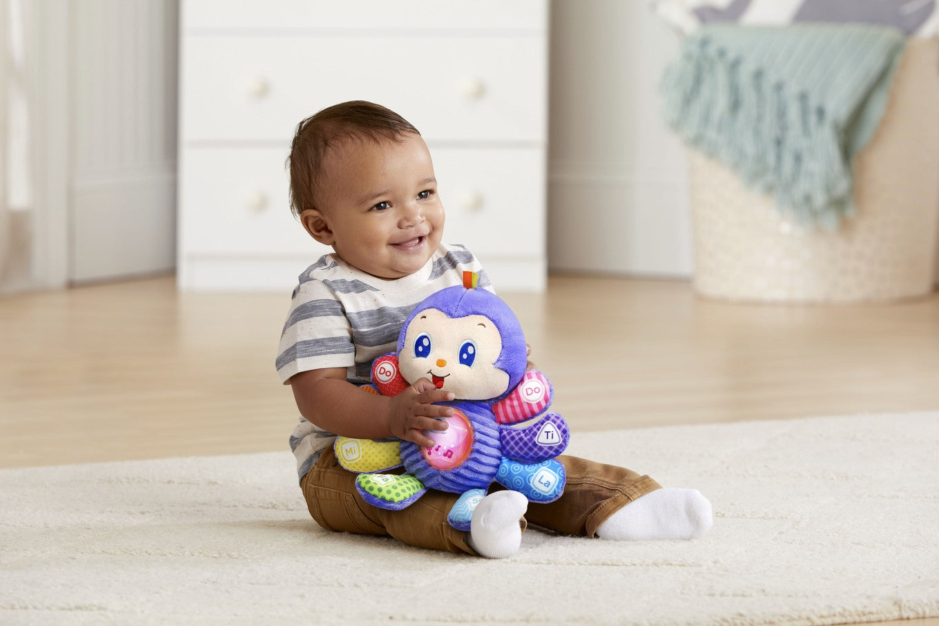 Baby playing with the VTech Musical Cuddle Critter