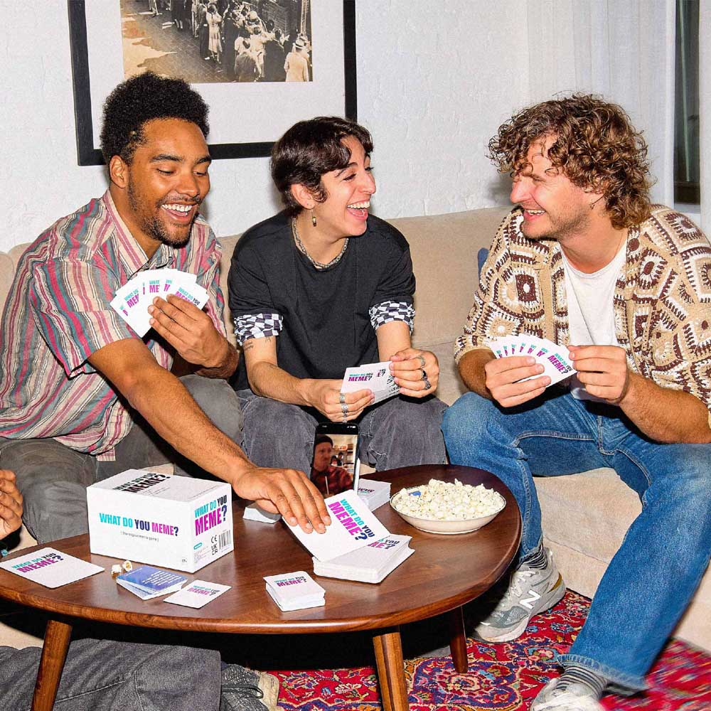 Adult friends playing the What Do You Meme? GIF Edition card game