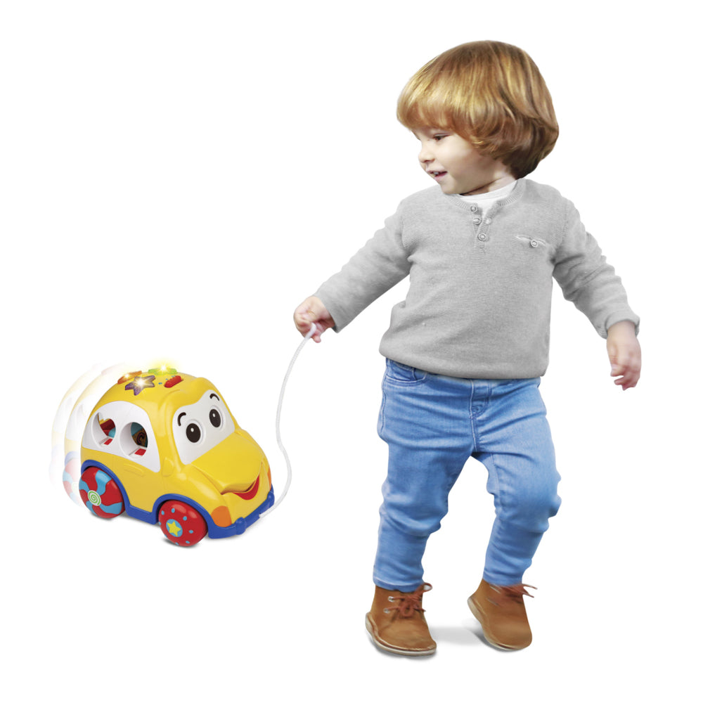 Toddler walking the Winfun Rhymes & Sorter Car with music and shape sorting learning