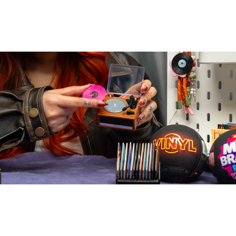 Handing using the ZURU Mini Brands Vinyl Playset Series 1