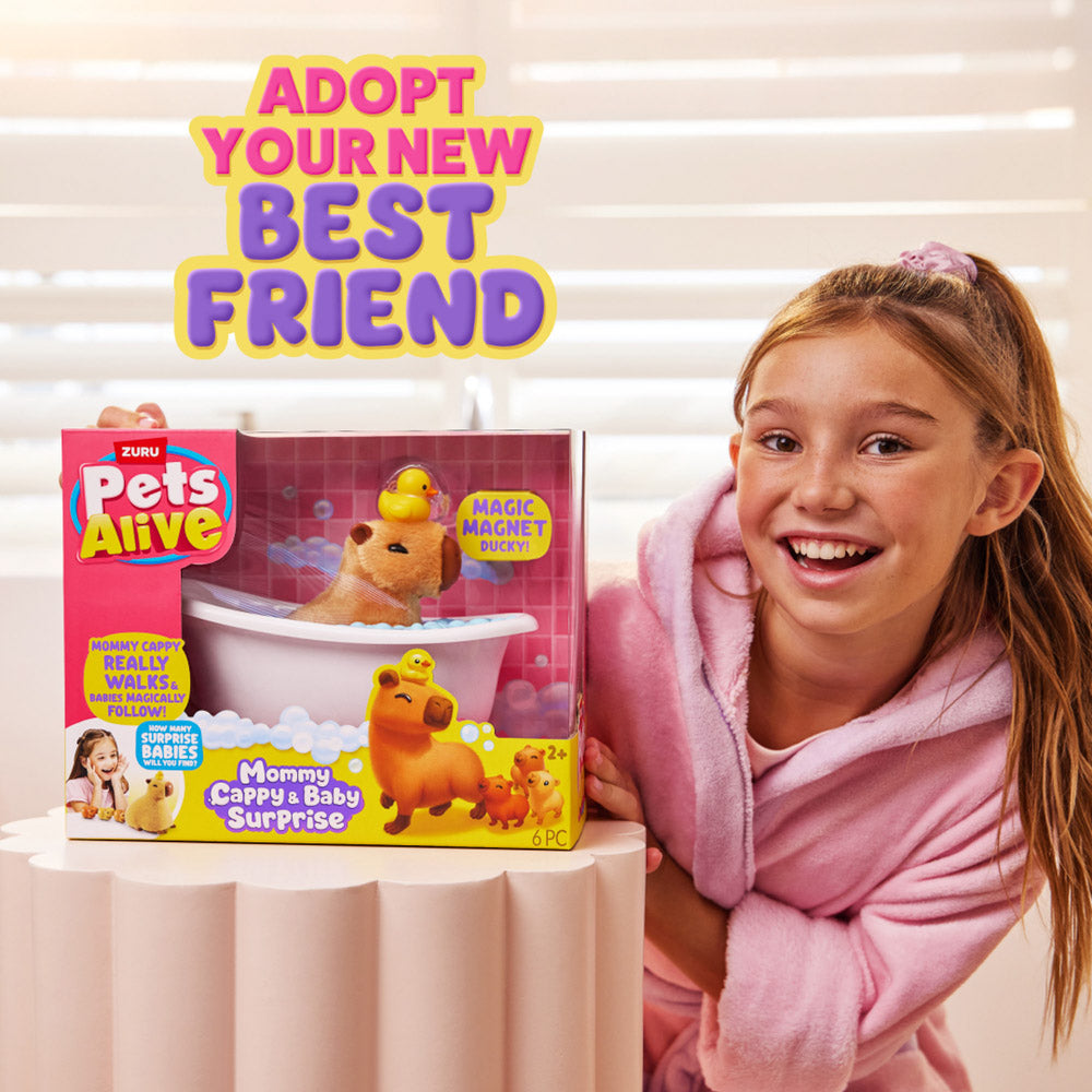 Child holding the ZURU Pets Alive Walking Mama Capybara and Baby Surprise toy