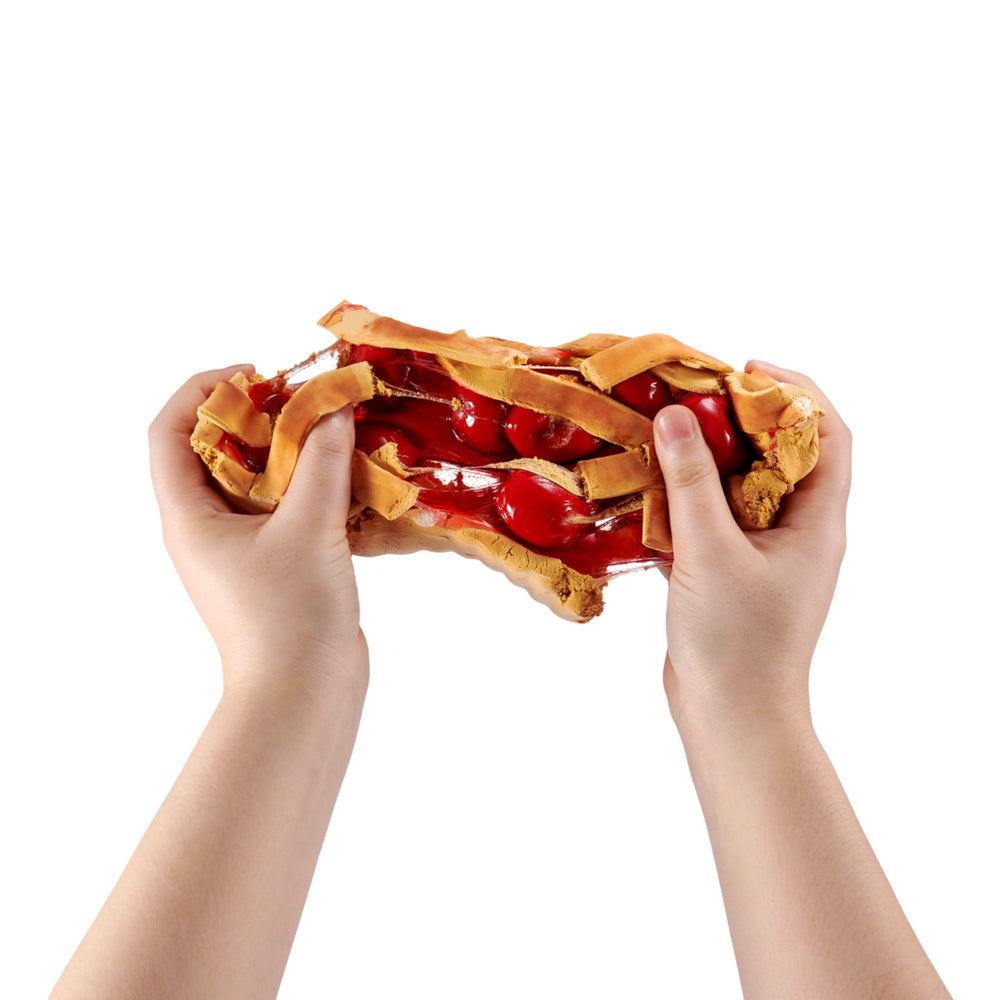 Hands stretching the ZURU Slime Mart Small Shopping Bag Series 2 Cherry Pie slime